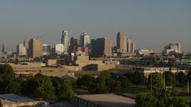5.7K aerial stock footage of the downtown skyline at sunrise, seen while descending near tech school in Downtown Kansas City, Missouri Aerial Stock Footage | DX0001_001027
