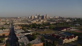 5.7K aerial stock footage of a reverse view of the city skyline, reveal community center in Downtown Kansas City, Missouri Aerial Stock Footage | DX0001_001032