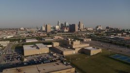 5.7K aerial stock footage a static and reverse view of tech school and the city skyline of Downtown Kansas City, Missouri Aerial Stock Footage | DX0001_001035