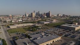 5.7K aerial stock footage reverse view of freeway and city skyline in Downtown Kansas City, Missouri Aerial Stock Footage | DX0001_001041