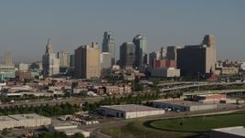 5.7K aerial stock footage of flying by the city's skyline from east of the freeway in Downtown Kansas City, Missouri Aerial Stock Footage | DX0001_001058