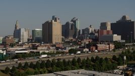 5.7K aerial stock footage of downtown high-rises seen while descending near freeway in Downtown Kansas City, Missouri Aerial Stock Footage | DX0001_001061