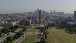 5.7K aerial stock footage circle the WWI memorial in Kansas City, Missouri, with a view of the downtown skyline Aerial Stock Footage | DX0001_001069