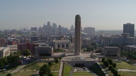5.7K aerial stock footage ascend and fly toward the WWI memorial in Kansas City, Missouri, with a view of the downtown skyline Aerial Stock Footage | DX0001_001071