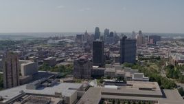 5.7K aerial stock footage of the city skyline behind Crown Center office buildings, Downtown Kansas City, Missouri Aerial Stock Footage | DX0001_001085