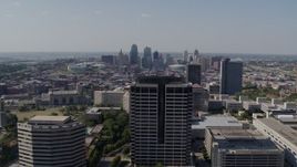 5.7K aerial stock footage reverse view of city skyline behind Crown Center office building, Downtown Kansas City, Missouri Aerial Stock Footage | DX0001_001087