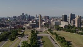 5.7K aerial stock footage of flying by the WWI memorial for a view of Downtown Kansas City, Missouri skyline Aerial Stock Footage | DX0001_001104