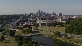 5.7K aerial stock footage descend and fly away from government office building and city skyline, Downtown Kansas City, Missouri Aerial Stock Footage | DX0001_001125