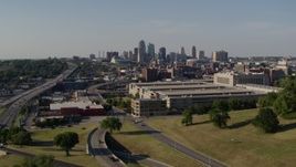 5.7K aerial stock footage ascend toward a government office building and city's skyline, Downtown Kansas City, Missouri Aerial Stock Footage | DX0001_001129