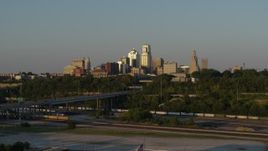 5.7K aerial stock footage of the city's skyline and freeway with light traffic at sunset in Downtown Kansas City, Missouri Aerial Stock Footage | DX0001_001164