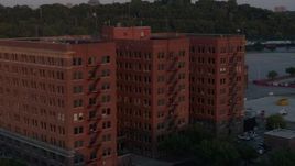 5.7K aerial stock footage of orbiting a brick office building at twilight in Kansas City, Missouri Aerial Stock Footage | DX0001_001172