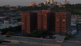 5.7K aerial stock footage orbit around a brick office building at twilight in Kansas City, Missouri Aerial Stock Footage | DX0001_001173