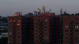 5.7K aerial stock footage static view of skyline at twilight and brick office building, Kansas City, Missouri Aerial Stock Footage | DX0001_001183