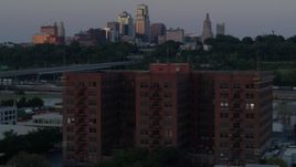5.7K aerial stock footage orbit brick office building at twilight, skyline in background, Kansas City, Missouri Aerial Stock Footage | DX0001_001184
