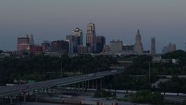 5.7K aerial stock footage of the I-670 freeway and city skyline at twilight in Downtown Kansas City, Missouri Aerial Stock Footage | DX0001_001192