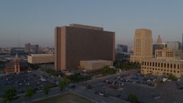 5.7K aerial stock footage a reverse view of a government building at sunrise, Downtown Kansas City, Missouri Aerial Stock Footage | DX0001_001206