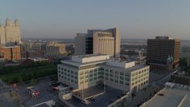 5.7K aerial stock footage approach government offices at sunrise, focus on federal courthouse, Downtown Kansas City, Missouri Aerial Stock Footage | DX0001_001216