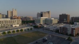 5.7K aerial stock footage reverse view of federal courthouse and government offices at sunrise, Downtown Kansas City, Missouri Aerial Stock Footage | DX0001_001217
