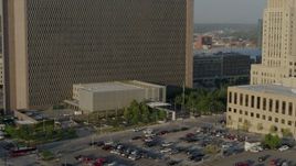 5.7K aerial stock footage reverse view of lower levels of a government office building at sunrise, Downtown Kansas City, Missouri Aerial Stock Footage | DX0001_001231