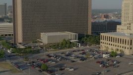 5.7K aerial stock footage fly away from a government office building at sunrise, Downtown Kansas City, Missouri Aerial Stock Footage | DX0001_001235