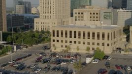 5.7K aerial stock footage of orbiting the downtown police station at sunrise, Downtown Kansas City, Missouri Aerial Stock Footage | DX0001_001237