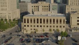 5.7K aerial stock footage of a view of the downtown police station at sunrise, Downtown Kansas City, Missouri Aerial Stock Footage | DX0001_001238