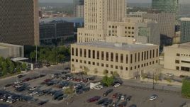 5.7K aerial stock footage fly away from the downtown police station at sunrise, Downtown Kansas City, Missouri Aerial Stock Footage | DX0001_001240