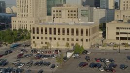 5.7K aerial stock footage a static and reverse view of the downtown police station at sunrise, Downtown Kansas City, Missouri Aerial Stock Footage | DX0001_001242