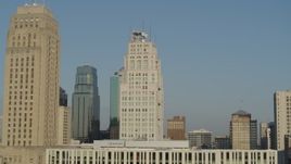 5.7K aerial stock footage slowly flyby skyscraper next to city hall at sunrise, Downtown Kansas City, Missouri Aerial Stock Footage | DX0001_001246