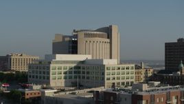 5.7K aerial stock footage federal courthouse behind government office building at sunrise, Downtown Kansas City, Missouri Aerial Stock Footage | DX0001_001247