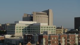 5.7K aerial stock footage descend by federal courthouse behind government building at sunrise, Downtown Kansas City, Missouri Aerial Stock Footage | DX0001_001249