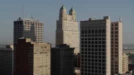 5.7K aerial stock footage approach and stationary view of a tall skyscraper at sunrise, Downtown Kansas City, Missouri Aerial Stock Footage | DX0001_001256