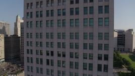5.7K aerial stock footage of reverse view of a city skyscraper at sunrise, Downtown Kansas City, Missouri Aerial Stock Footage | DX0001_001273