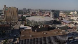 5.7K aerial stock footage of flying away from the arena in downtown at sunrise, Downtown Kansas City, Missouri Aerial Stock Footage | DX0001_001283