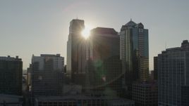 5.7K aerial stock footage of the setting sun behind city skyscrapers in Downtown Kansas City, Missouri Aerial Stock Footage | DX0001_001346