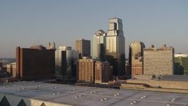 5.7K aerial stock footage of the setting sun shining on downtown skyscrapers in Downtown Kansas City, Missouri Aerial Stock Footage | DX0001_001348