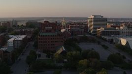 5.7K aerial stock footage approach brick office building and cathedral steeple at sunset in Downtown Kansas City, Missouri Aerial Stock Footage | DX0001_001352