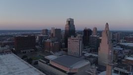 5.7K aerial stock footage of a stationary view of tall city skyscrapers at sunset in Downtown Kansas City, Missouri Aerial Stock Footage | DX0001_001366
