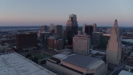 5.7K aerial stock footage flyby tall city skyscrapers at sunset and descend in Downtown Kansas City, Missouri Aerial Stock Footage | DX0001_001367