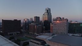 5.7K aerial stock footage reverse and flyby skyscrapers at sunset in Downtown Kansas City, Missouri Aerial Stock Footage | DX0001_001370