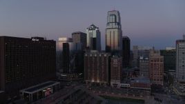 5.7K aerial stock footage of a downtown hotel and tall city skyscrapers at twilight in Downtown Kansas City, Missouri Aerial Stock Footage | DX0001_001382