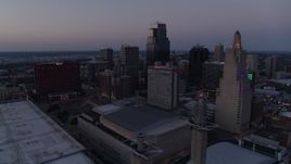 5.7K aerial stock footage static view of city skyscrapers lit up for the evening at twilight in Downtown Kansas City, Missouri Aerial Stock Footage | DX0001_001385