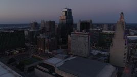 5.7K aerial stock footage of flying by skyscrapers and office buildings at twilight in Downtown Kansas City, Missouri Aerial Stock Footage | DX0001_001386