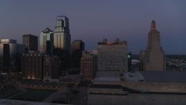 5.7K aerial stock footage flyby a downtown hotel and skyscrapers at twilight in Downtown Kansas City, Missouri Aerial Stock Footage | DX0001_001391