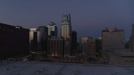 5.7K aerial stock footage of skyscrapers between hotels and city buildings at twilight in Downtown Kansas City, Missouri Aerial Stock Footage | DX0001_001395