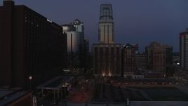 5.7K aerial stock footage of skyscrapers between hotels and office buildings at twilight in Downtown Kansas City, Missouri Aerial Stock Footage | DX0001_001396