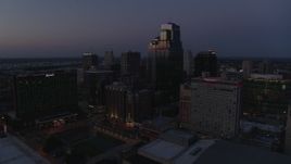 5.7K aerial stock footage of reverse view of skyscrapers, hotels and city park at twilight in Downtown Kansas City, Missouri Aerial Stock Footage | DX0001_001397