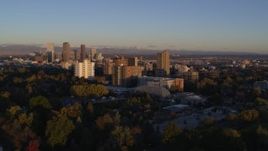 5.7K aerial stock footage of a reverse view of apartment buildings at sunrise in Denver, Colorado Aerial Stock Footage | DX0001_001400