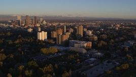 5.7K aerial stock footage ascend for stationary view of apartment buildings at sunrise in Denver, Colorado Aerial Stock Footage | DX0001_001401