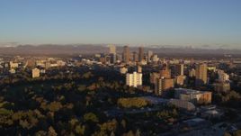 5.7K aerial stock footage of skyscrapers seen from apartment complexes at sunrise, Downtown Denver, Colorado Aerial Stock Footage | DX0001_001404
